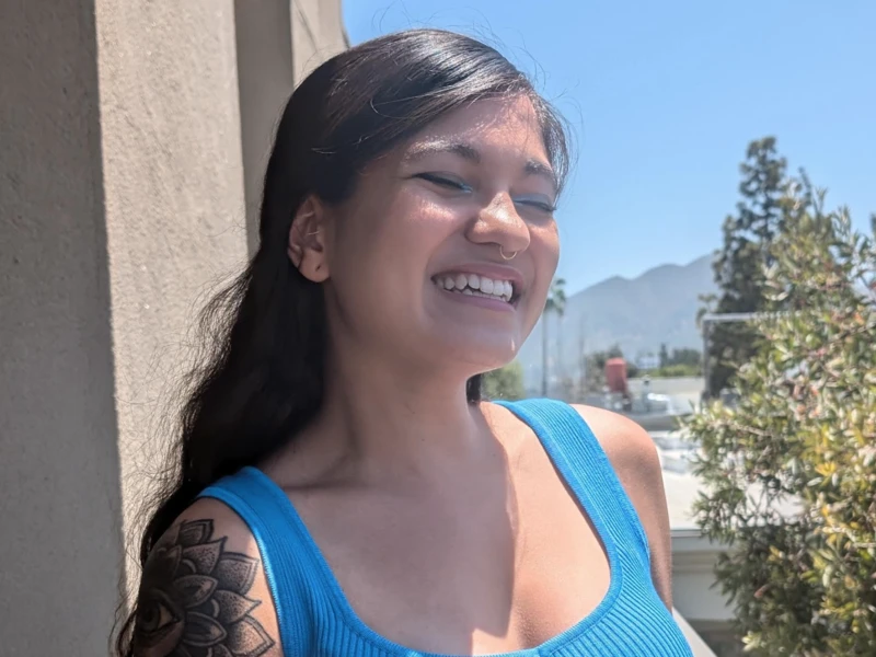 CalArts grad Val Costa smiles in the sunshine.